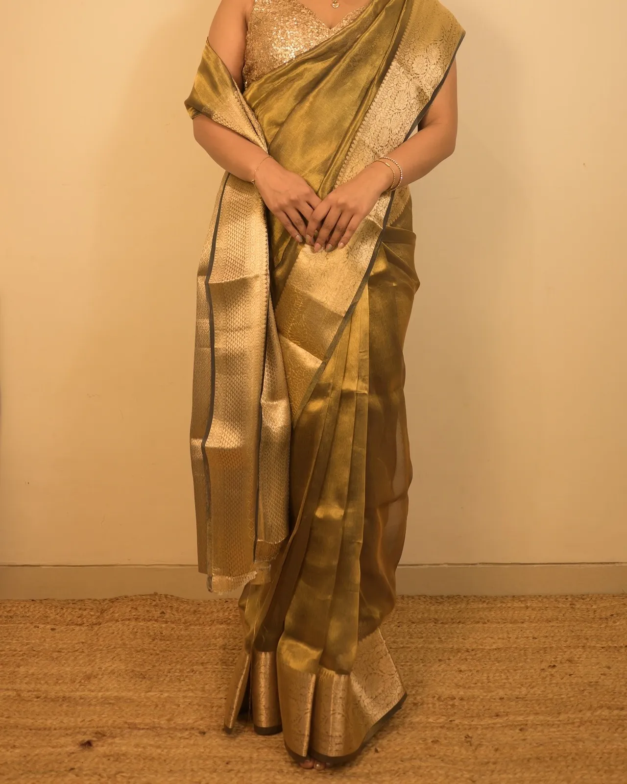 Golden brocade tissue silk saree, full-length drape with a sequin blouse