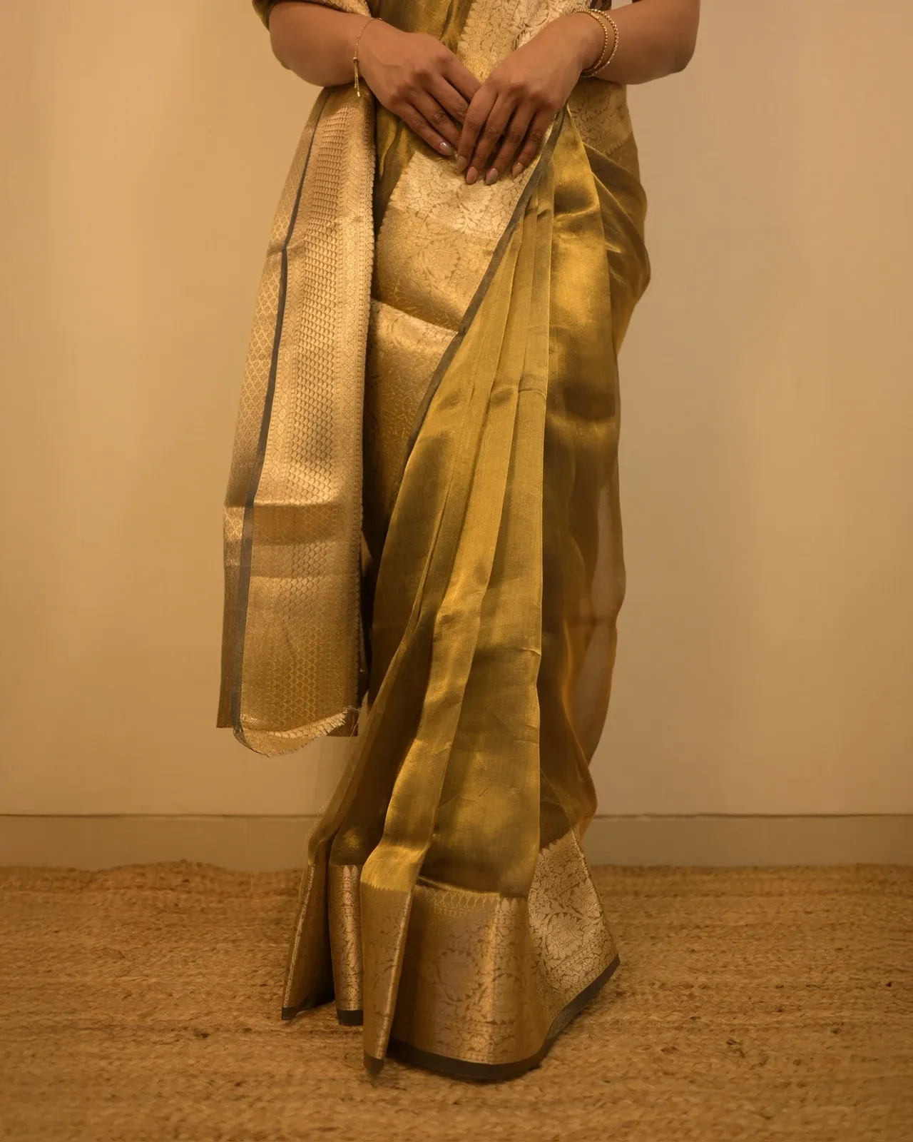 Waist-down drape of the golden brocade tissue saree