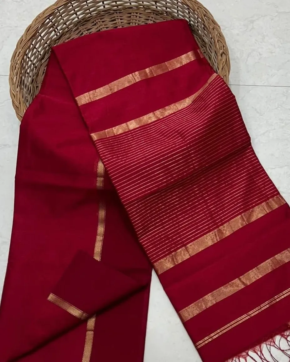 Maroon red cotton silk saree with zari stripes, folded