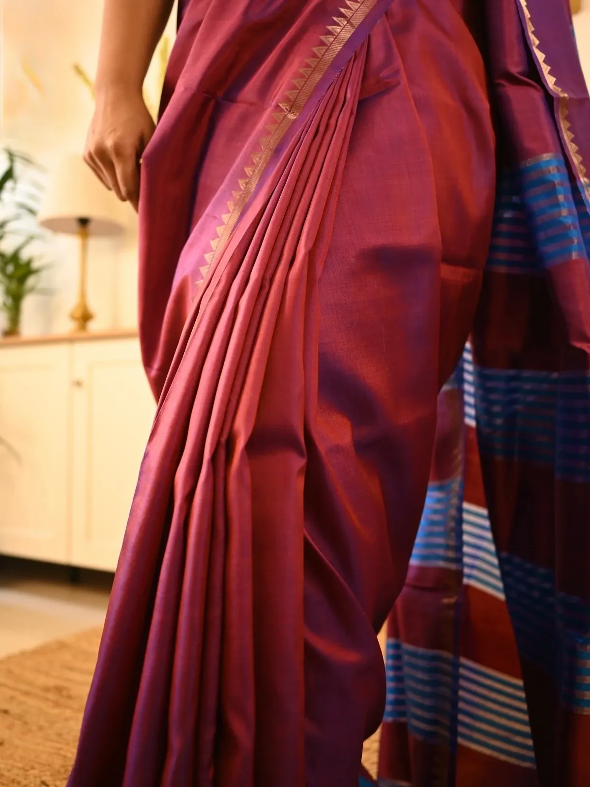Pleats and temple border close-up on a katan silk saree